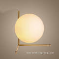 Gold simple metal brackets opal glass table lights